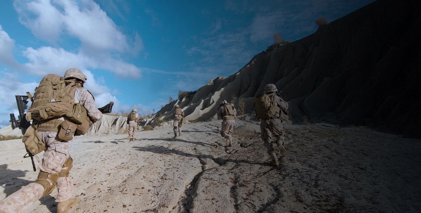 Ground operations team running through the sand